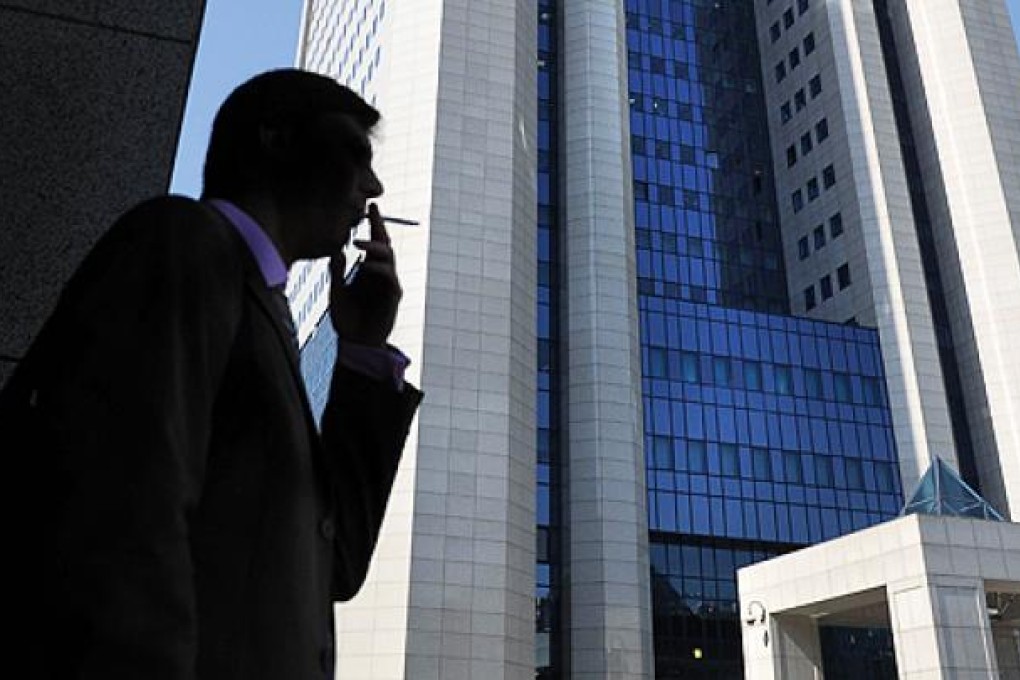 Vladimir Putin has signed a law banning smoking in public places in Russia from June. Photo: AFP