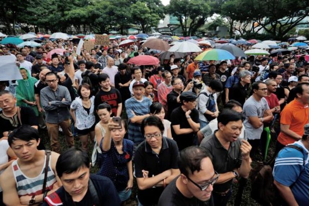 A protest against an immigration plan that could see Singapore population increase 30 per cent by 2030. Photo: EPA