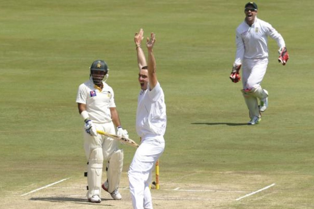 Kyle Abbott (centre) is a new South African sports hero after taking nine wickets for 68 runs on his test debut. Photo: AP