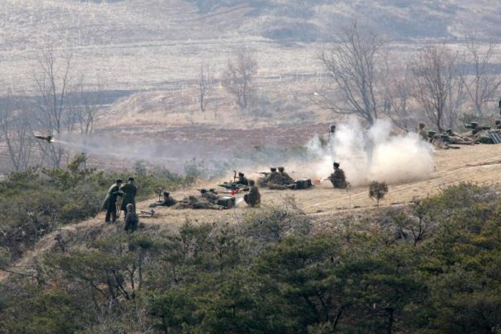A Korean People's Army artillery unit takes part in the drill, during which Kim Jong-un was described as 'feasting his eyes'. Photo: AP