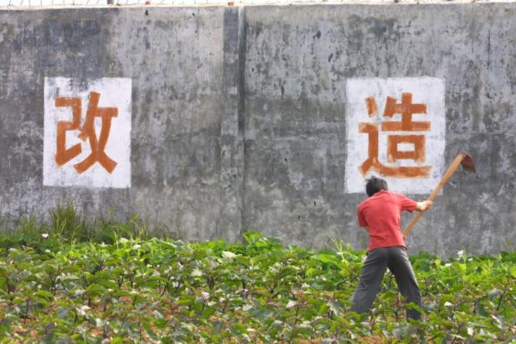 A man does farm work in a drug treatment camp in Hainan province. Photo: Imaginechina