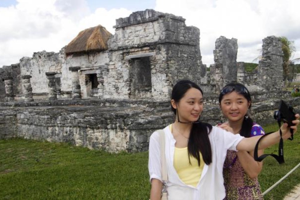 Travel industry analysts are seeing a growing interest among Chinese tourists for independent overseas travel rather than group tours. Photo: AFP