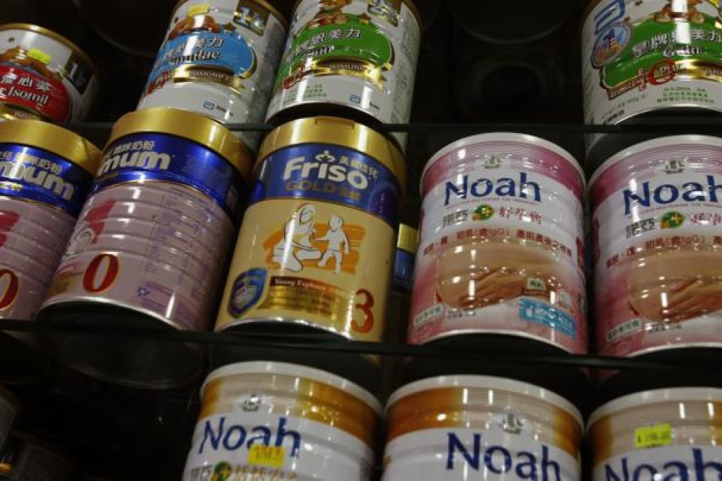 Starting in March, people leaving Hong Kong will be allowed to carry only two cans of milk formula across the border. Photo: Reuters