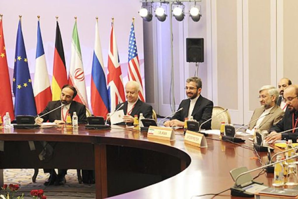 Members of the Iranian delegation, led by chief nuclear negotiator Saeed Jalili (third left), attend talks in Almaty on Tuesday. Photo: Reuters