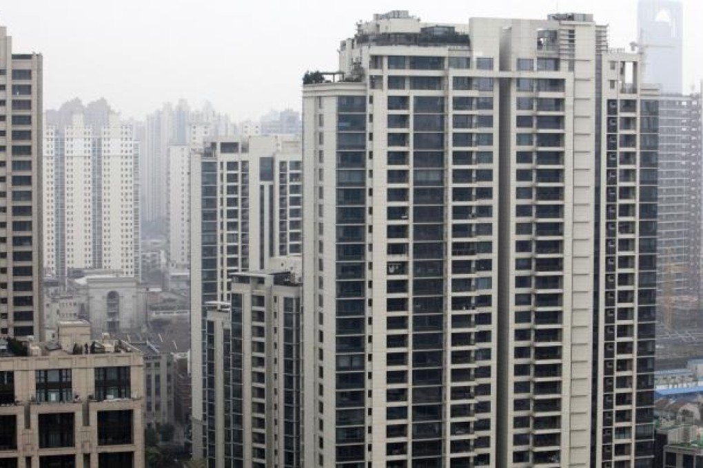 A 1,076 sq ft flat on the mainland today costs about 40 years' income, data shows. Photo: Bloomberg