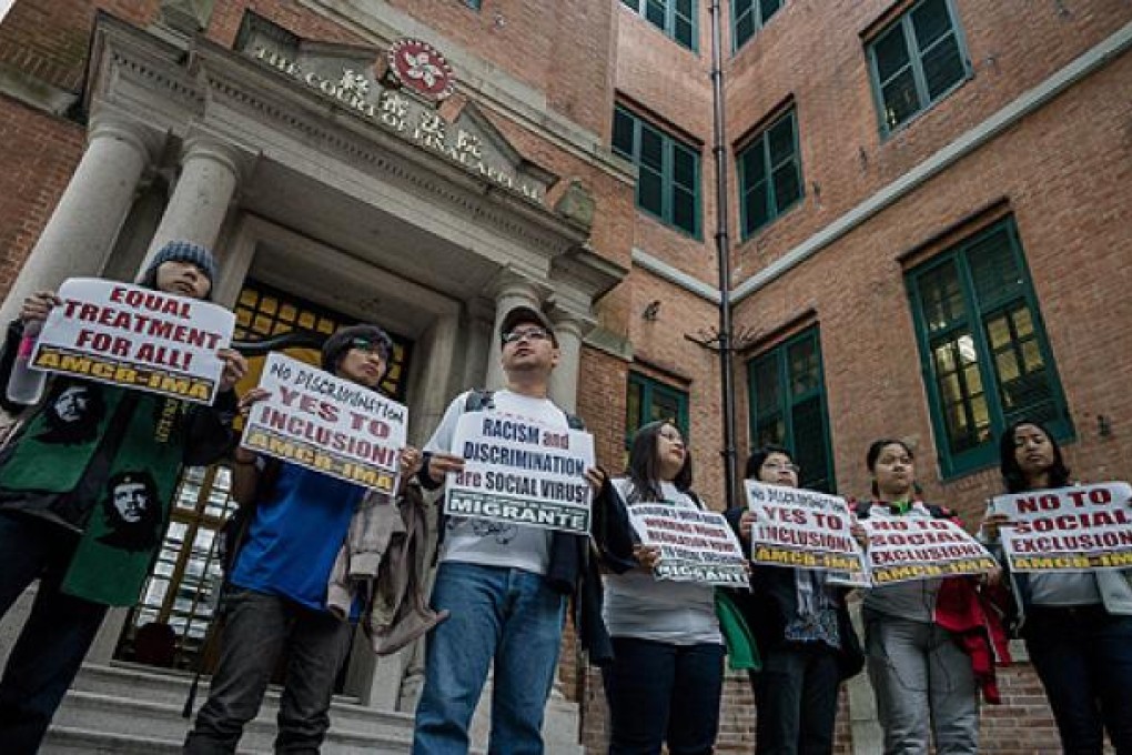 Protesters call for equal rights outside the Court of Final Appeal, which is hearing a case that will affect thousands of domestic helpers. Photo: AFP