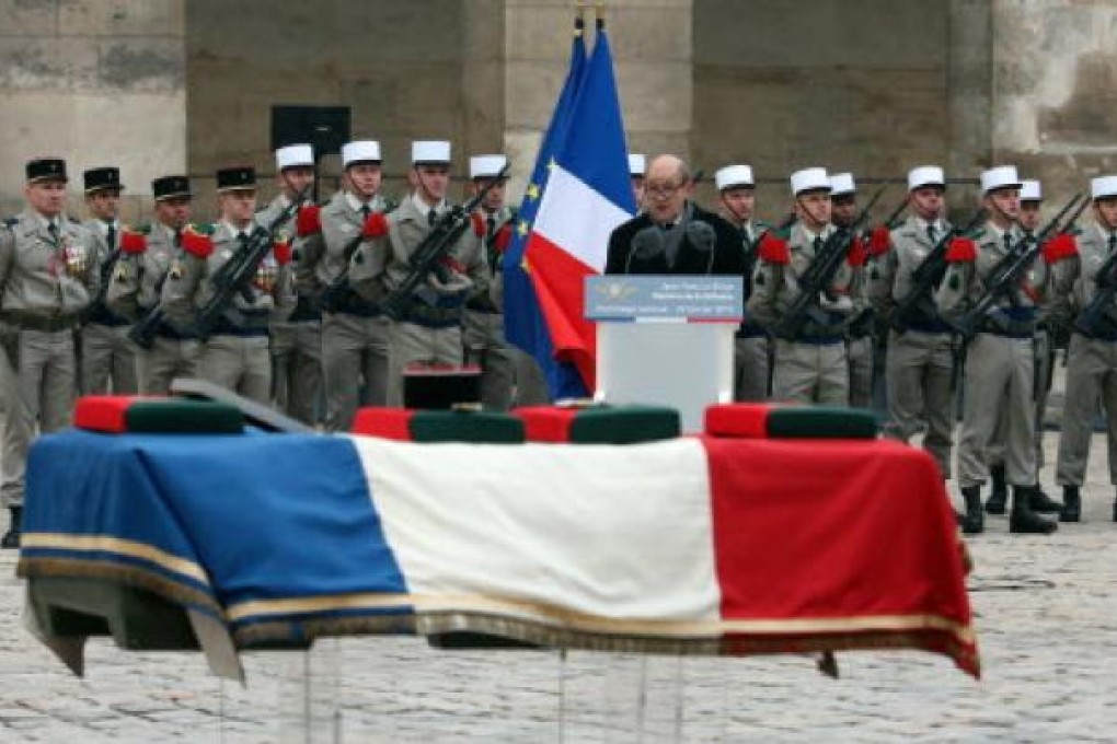 French Defence minister Jean-Yves Le Drian speaks during a ceremony in Paris for a French soldier recently killed in Mali. Photo: AFP