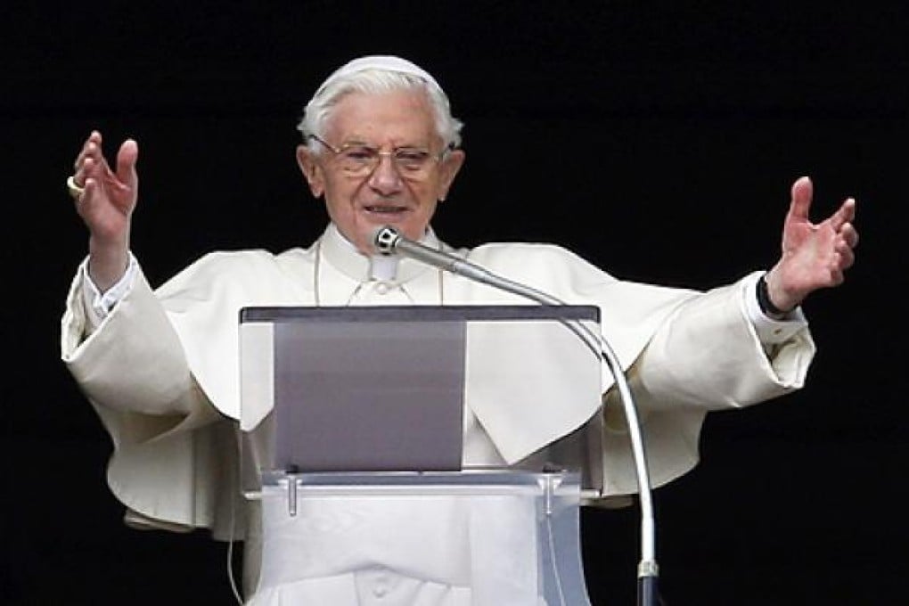 Pope Benedict XVI gestures as he leads his last Sunday Angelus prayer before stepping down in Saint Peter's Square at the Vatican on Sunday. Photo: Reuters
