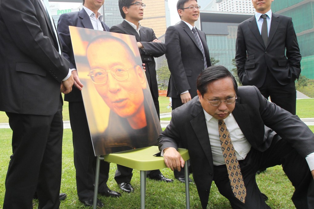 Lawmakers (from left) Ronny Tong Ka-wah, Sin Chung-kai, Chan Ka-lok and Dennis Kwok Wing-hang, along with Albert Ho Chun-yan (front), join Friends of Liu Xiaobo and Independent Chinese PEN Centre in Tamar yesterday to lobby for the release of the jailed Nobel peace laureate. Photo: Felix Wong