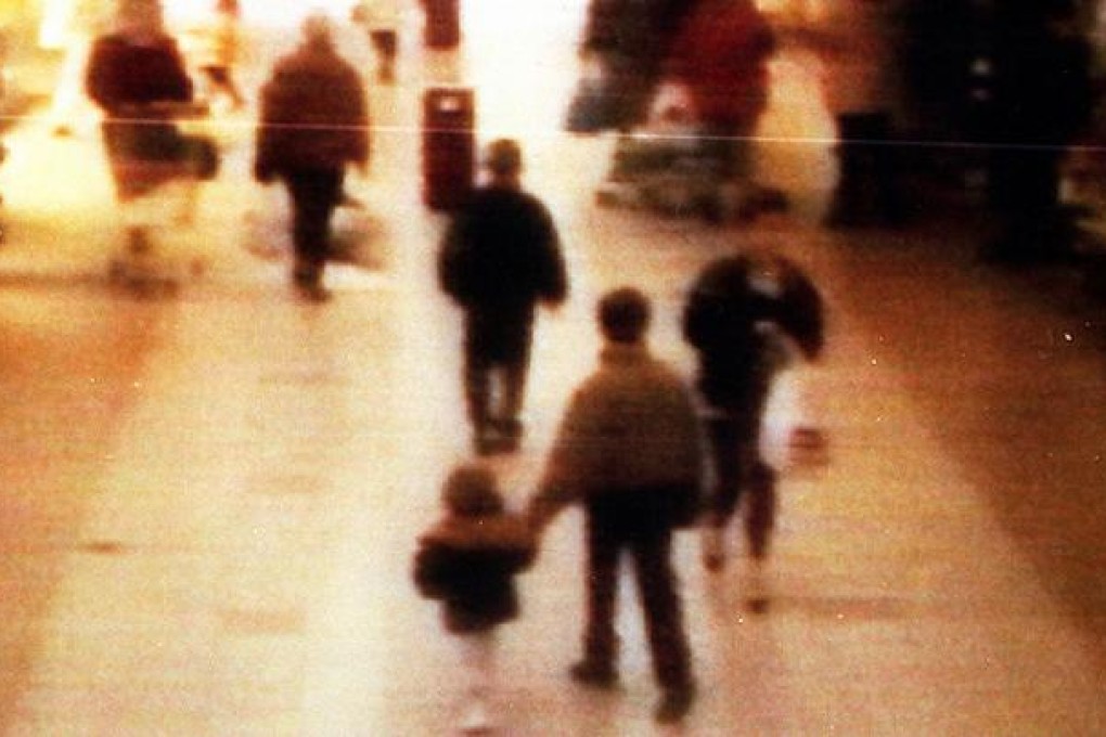 Video still of James Bulger, aged 2 years old, foreground left, being led away in the 'New Strand' shopping centre in the Bootle area of Liverpool. Photo: AP