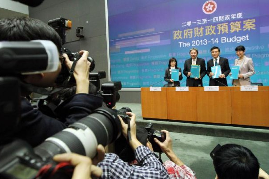 John Tsang and his team present the budget report. Critics said it was too conservative and offered little short-term relief. Photo: Felix Wong