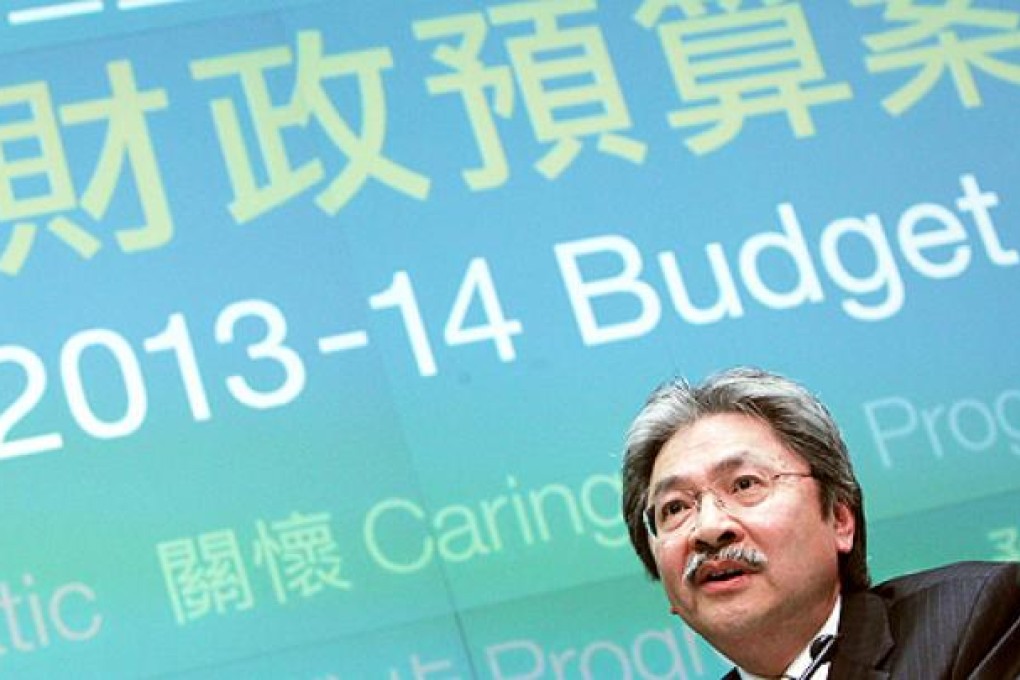 Financial Secretary John Tsang Chun-wah attends a news conference after delivering his budget speech. Photo: David Wong