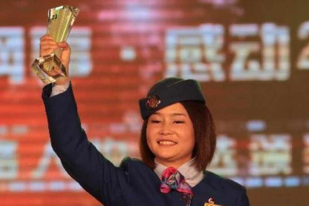 Tie Feiyan receives an award in 2010 for her heroic acts. Photo: Xinhua