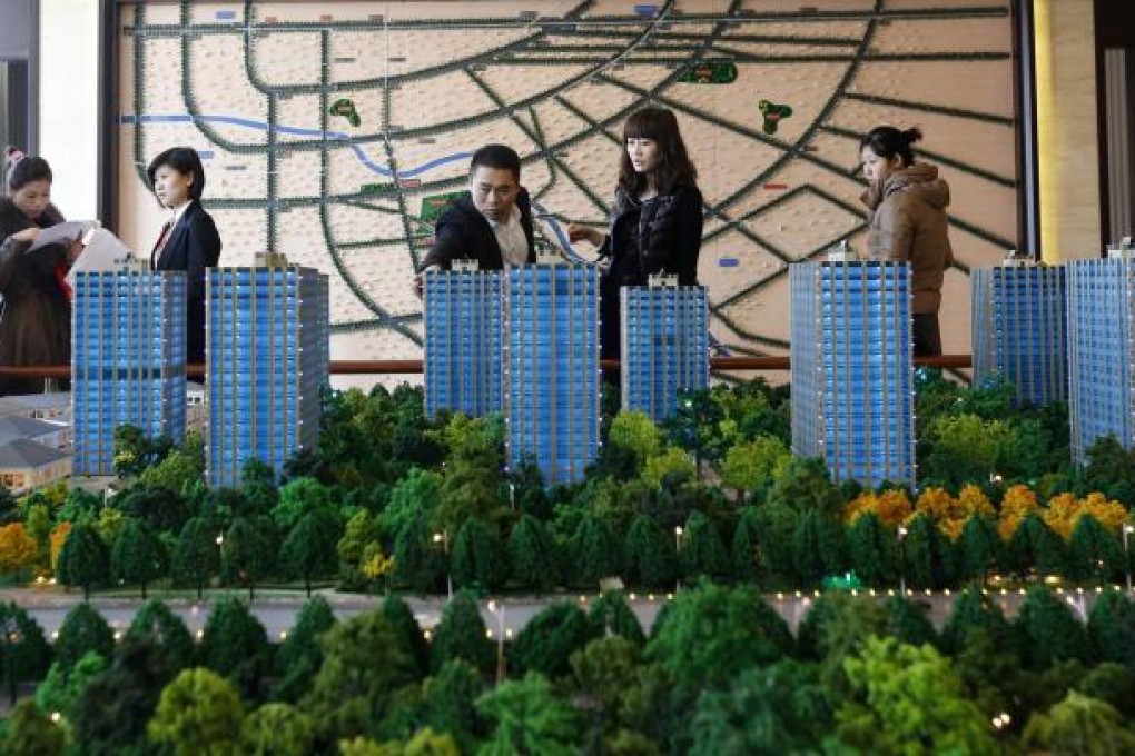 Prospective buyers at a property showroom in Beijing, where average real estate prices have risen 365 per cent to 20,700 yuan a square metre between 2003 and last year, outpacing the national average increase of 145 per cent. Photo: Reuters