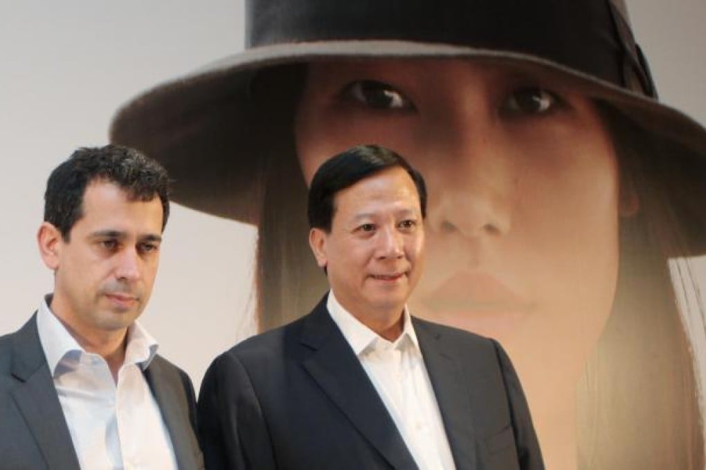 Esprit chief Jose Manuel Martinez Gutierrez, left, and executive director Thomas Tang, see a softening in the firm's decline. Photo: Paul Yeung