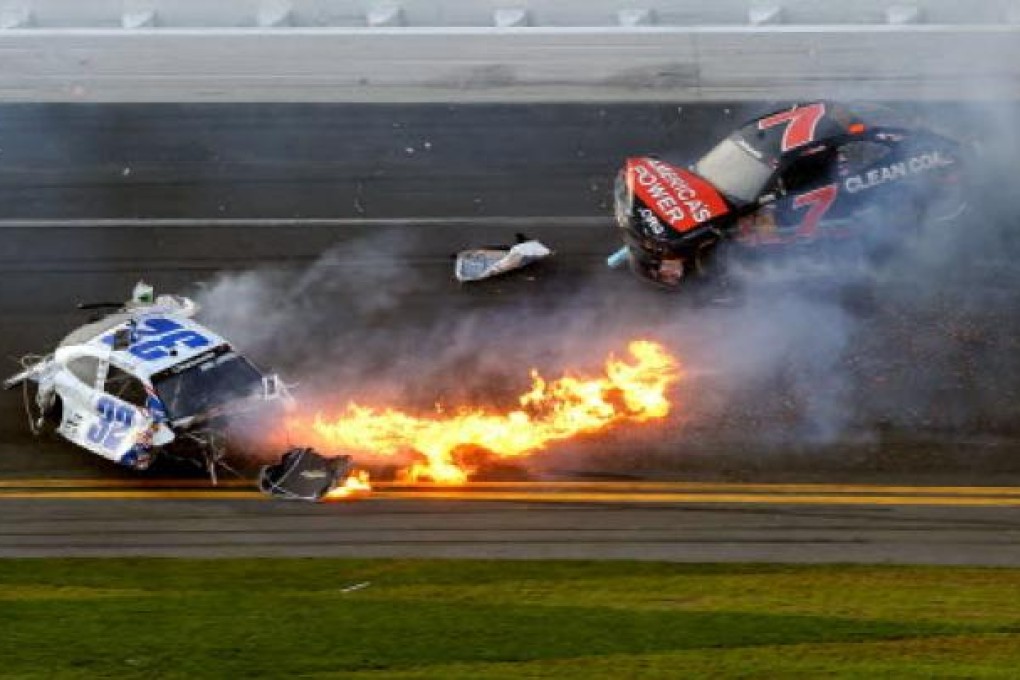 Kyle Larson, driver of the #32 Clorox Chevrolet, and Regan Smith, driver of the #7 Clean Coal Chevrolet, in an incident at the Daytona International Speedway on Sunday. Photo: AFP
