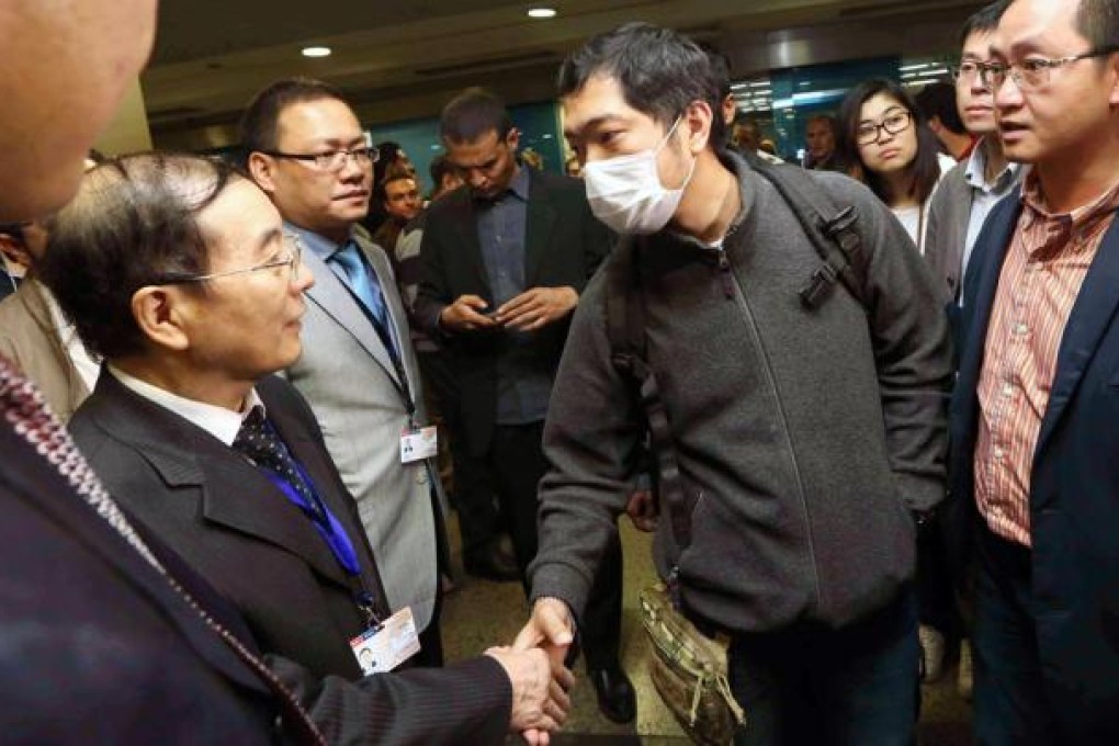 Relatives of victims are met by Song Aiguo, China’s ambassador to Egypt, at Cairo’s international airport yesterday. Photo: Sam Tsang