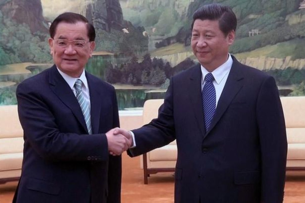 Lien Chan (left) and Xi Jinping in Beijing on Monday. Photo: Reuters