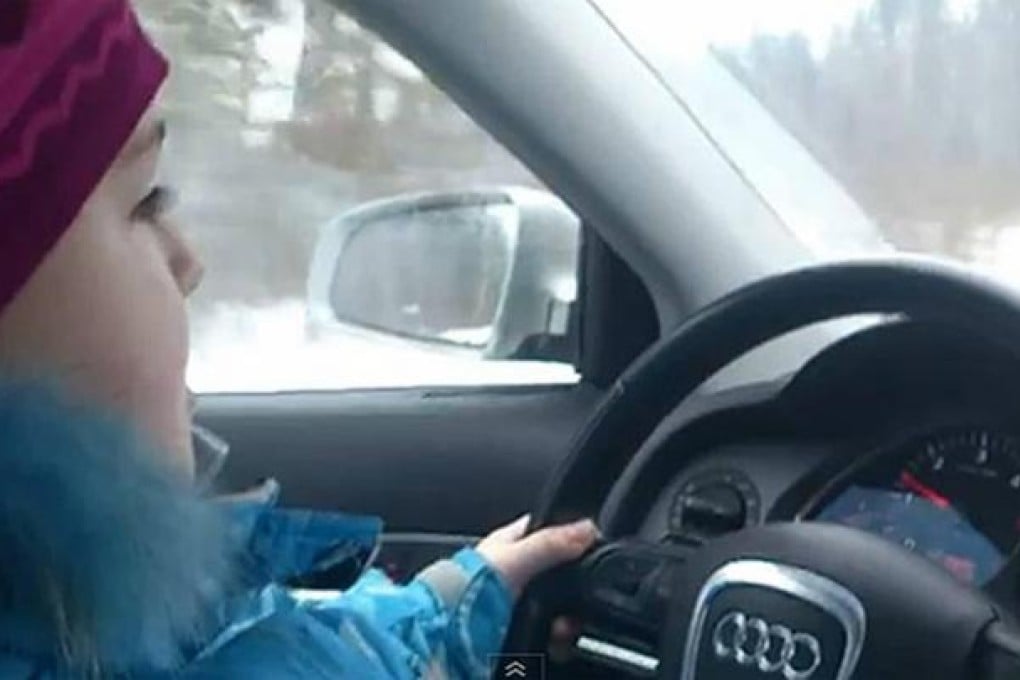 A video image of the girl, Karina Mikulchik, driving the Audi car.