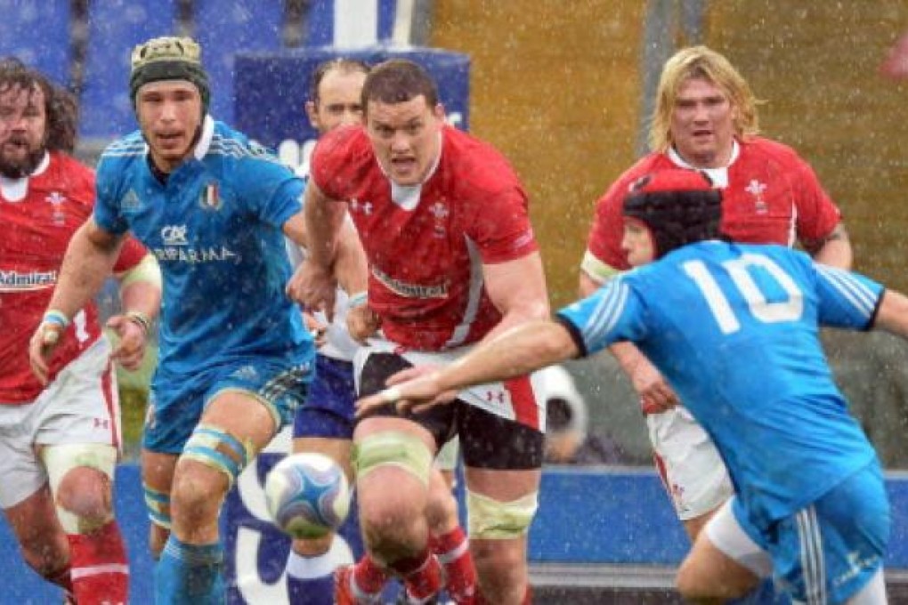 Ian Evans (centre) of Wales. Photo: AFP