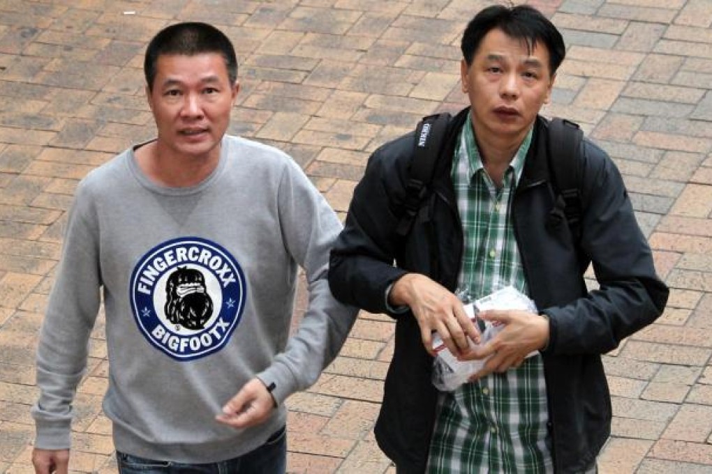 The arrested men before the attack on photographer May Tse.