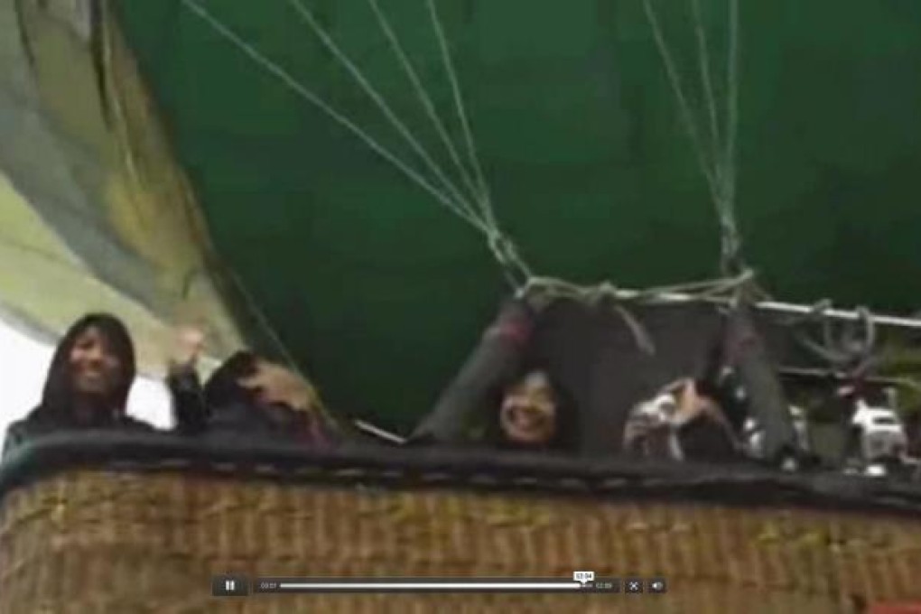 Heading for disaster: Poon Tak-sze, Poon Lau-tim and Kwan Pui-man show their excitement as they head off over Luxor in the hot-air balloon for what was meant to be the trip of a lifetime. Photo: SCMP