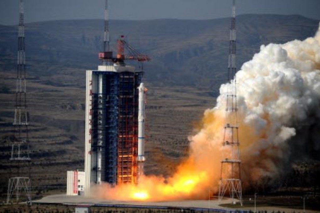 The Long March 2C rocket carrying two satellites blasts off in Taiyuan, Shanxi, last year. China wants to boosts its share of the satellite launching business. Photo: Xinhua