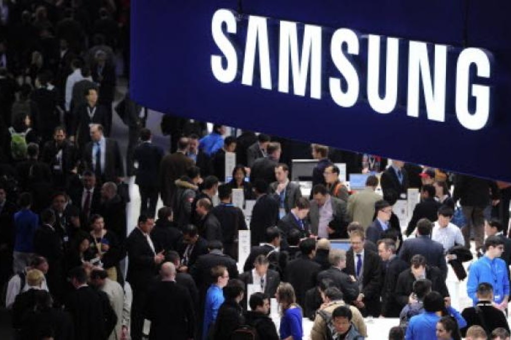 People visit a Samsung stand in Barcelona  on the second day of the 2013 Mobile World Congress. Photo: AFP