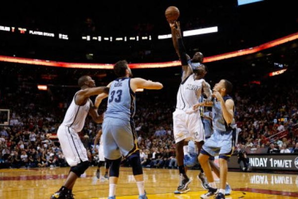 LeBron James of the Miami Heat competes for a rebound with Quincy Pondexter of the Memphis Grizzlies. Photo: AFP