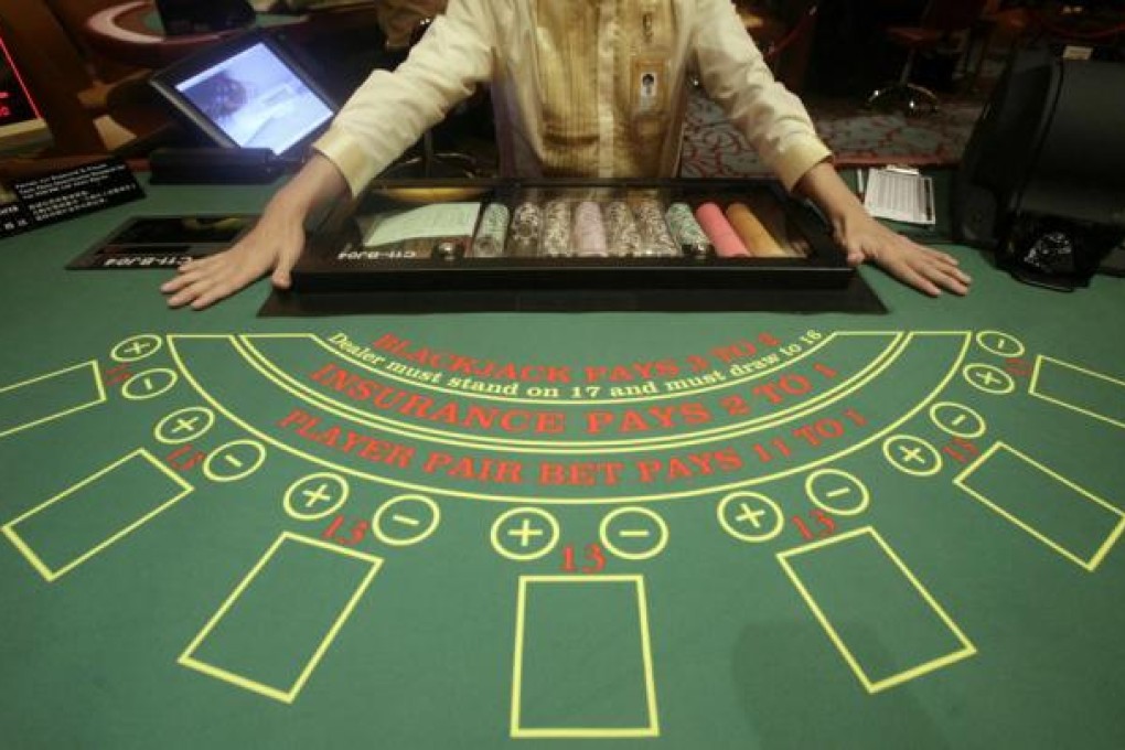 Macau’s casinos raked in gross gaming revenue of 304.1 billion patacas last year, an increase of 13.5 per cent from 2011. Photo: Reuters