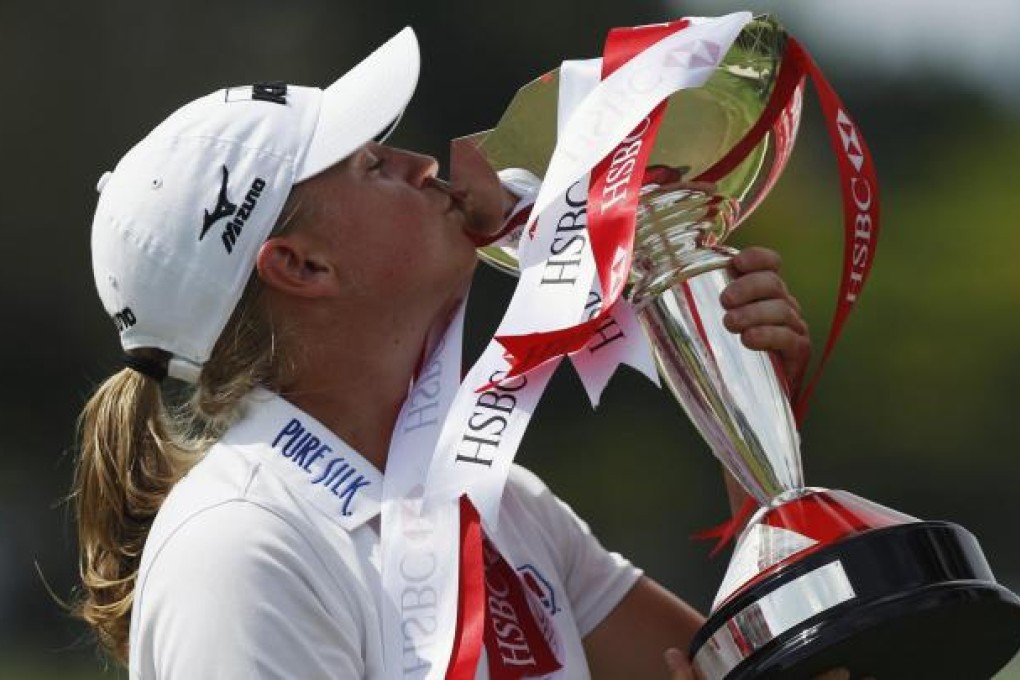 Stacy Lewis kisses her trophy yesterday. Photo: Reuters