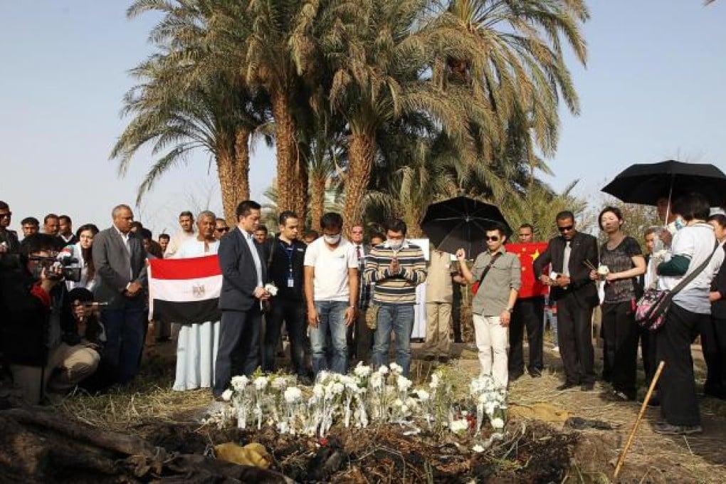 Relatives of the Hong Kong victims of the Egyptian hot-air balloon tragedy perform rituals at the crash site yesterday. Photo: Sam Tsang