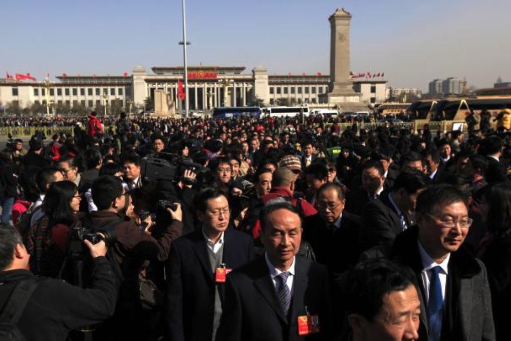 Chinese delegates arrive for the opening of the first session of the 12th National Committee of the Chinese People's Political Consultative Conference in Beijing. Photo: EPA