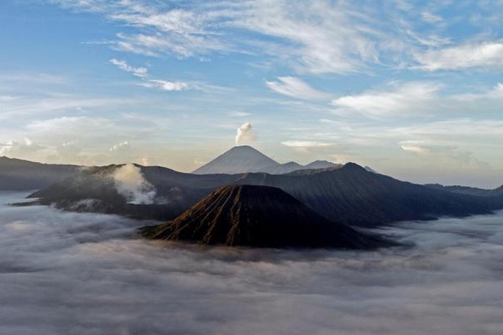Few sights are more rewarding after a long hike than the majestic peaks of Mount Bromo and Mount Semeru (in the background) above the mist of East Java. Photos: Christian Glassl