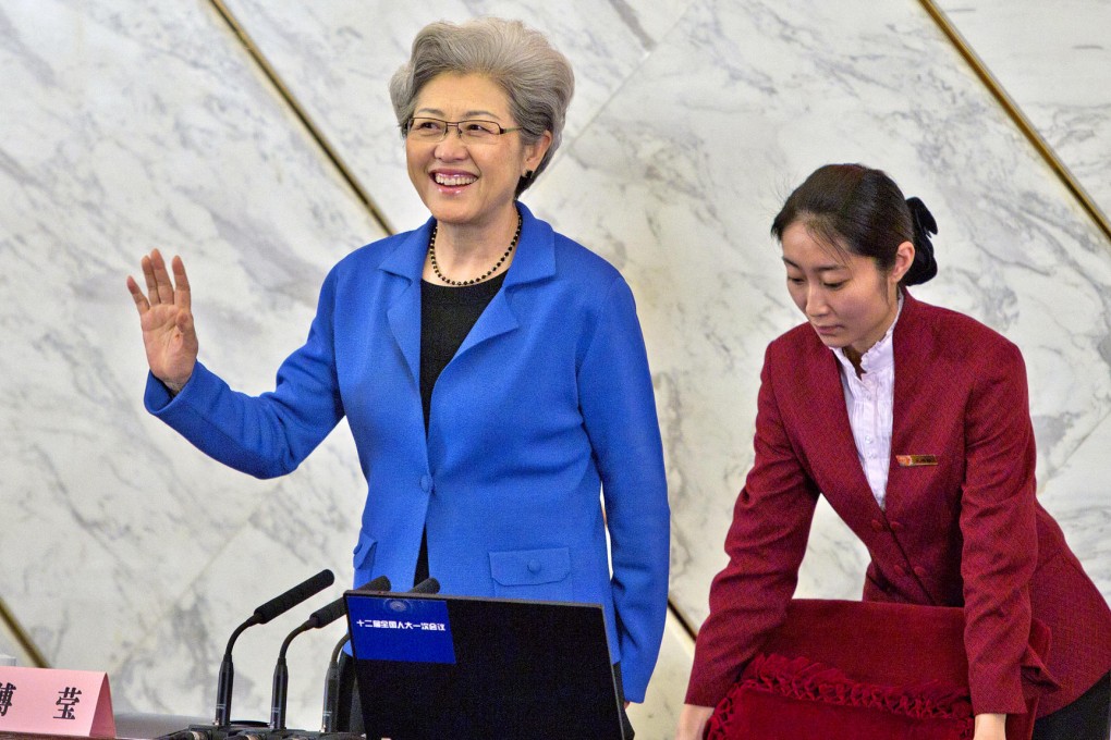 Fu Ying, the first woman to become an NPC session spokesperson, is shown to her chair at a press conference at the Great Hall of the People in Beijing. Photo: Simon Song