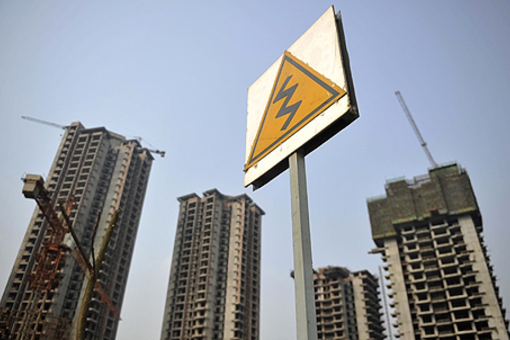 Residential housing blocks under construction in Chongqing. The Chinese government  ordered the central bank to raise downpayments and mortgage lending rates for buyers of second homes in some cities. Photo: Reuters