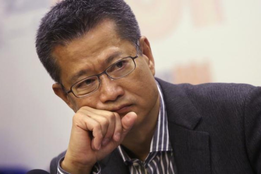 Secretary for Development Paul Chan Mo-po announced that the 14-year-old land sale system would be replaced by regular tender. Photo: Sam Tsang