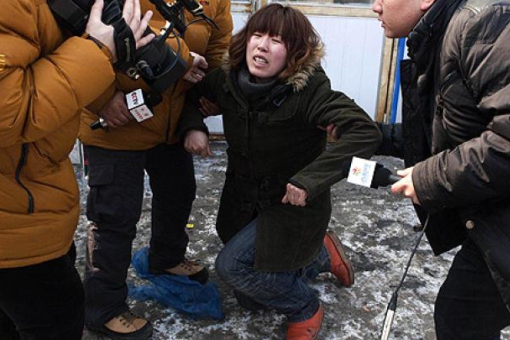 The baby's aunt weeps and pleads for its safe return in Changchun on Tuesday. Photo: SCMP pictures