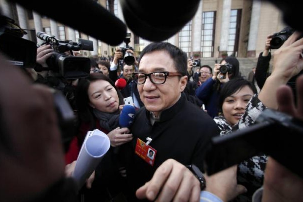 Journalists mob Jackie Chan at the CPPCC. Photo: Reuters