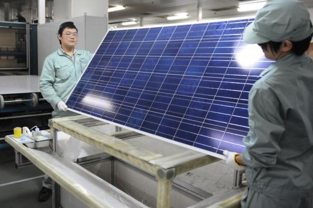 Workers inspect solar panels at a Suntech Power Holdings factory in Wuxi, China. Photo: AFP