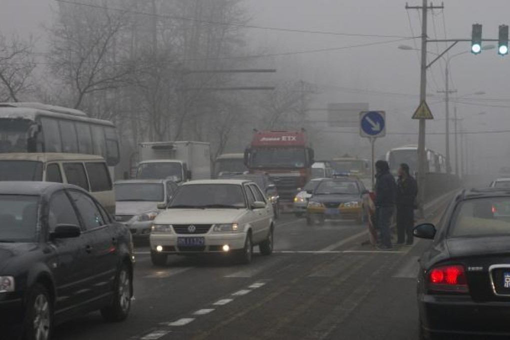 Heavy smog smothers an expressway in the suburbs of Beijing. East, central and northern China are all suffering from hazardous levels of PM2.5 air pollution which is beyond the upper end of the scale of the US and WHO standard measurement systems. Photo: EPA