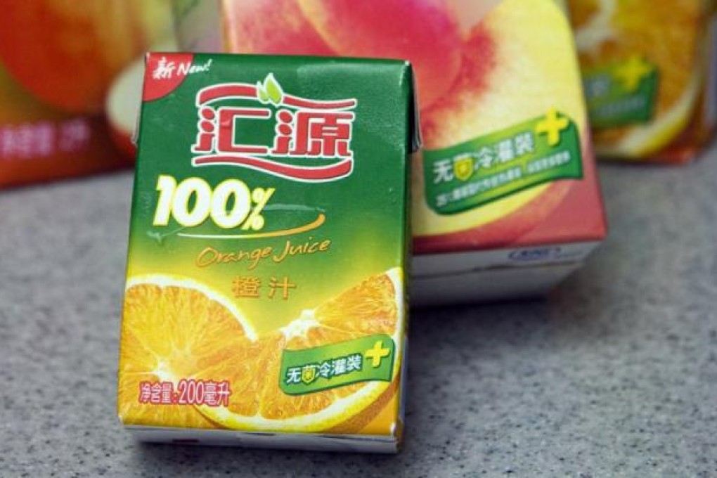 Packs of Huiyuan brand fruit juices. Photo: EPA