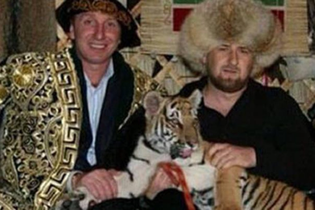 Chechnya's leader, Ramzan Kadyrov (right) with tiger. Photo: SCMP Pictures
