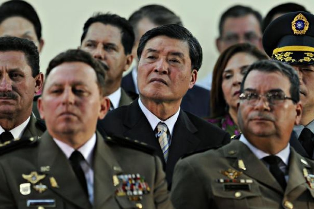 Taiwan Defence Minister Kao Hua-chu (centre) gave a briefing on the voluntary system. Photo: AFP