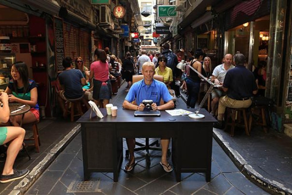 Tourism Australia shows former winner Britain's Ben Southall sitting behind a desk in a Melbourne lane as the industry resurrected its hugely popular "Best Jobs in the World" campaign. Photo: AFP
