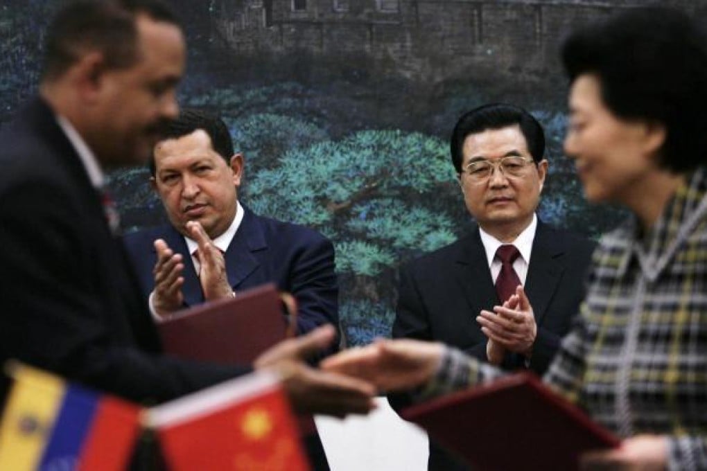 Hu Jintao joins Hugo Chavez during an agreement-signing ceremony in September 2008 at the Great Hall of the People in Beijing.Photo: AP