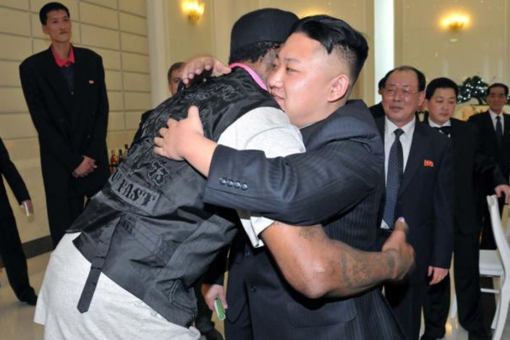 North Korean leader Kim Jong-Un and former NBA basketball player Dennis Rodman hug in Pyongyang. Photo: Reuters