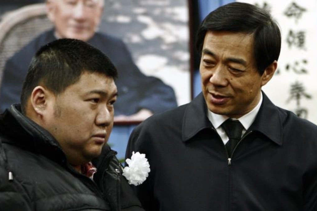 Mao Xinyu (left), grandson of Mao Zedong, with disgraced party boss Bo Xilai at a funeral for Bo's father. Photo: Reuters