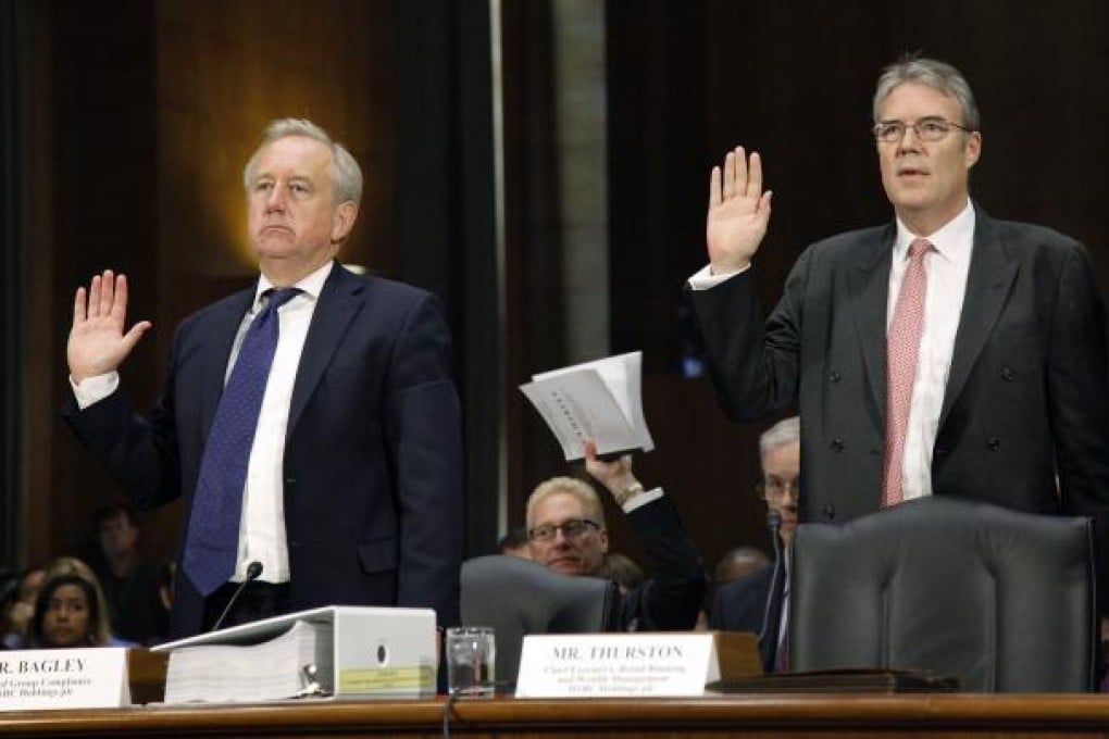 David Bagley (left), head of group compliance for HSBC Holdings, and Paul Thurston, chief executive officer of retail banking and wealth management for HSBC, at a hearing on the money laundering allegations. Photo: Bloomberg