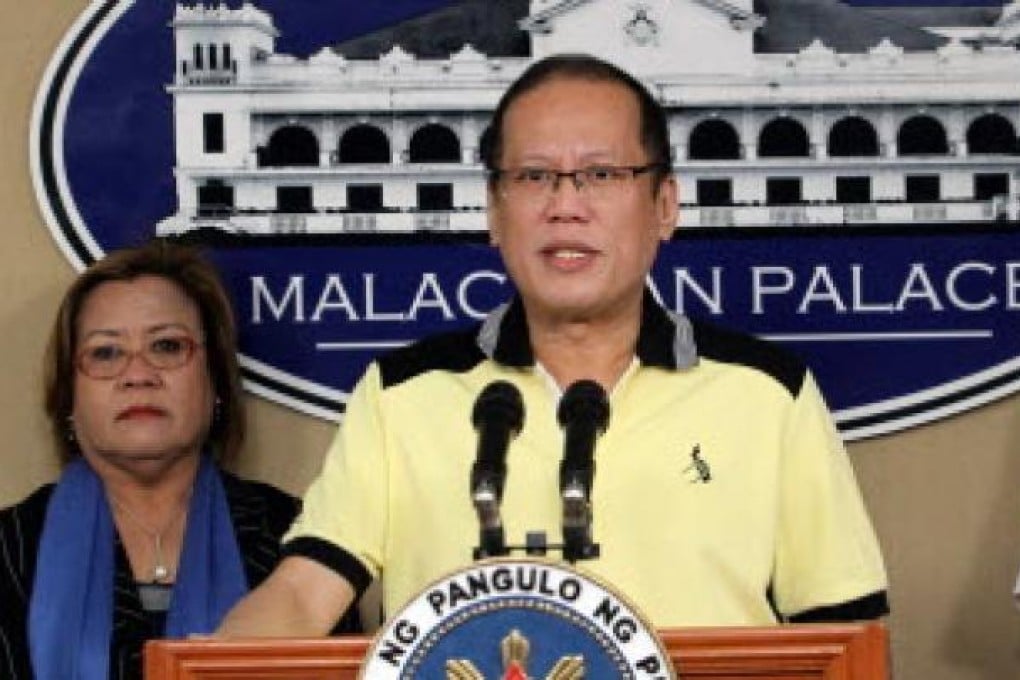 Philippine President Benigno Aquino and Justice secretary Leila de Lima (left). Aquino has asked Lima to probe claims police and soldiers executed 13 people. Photo: AFP